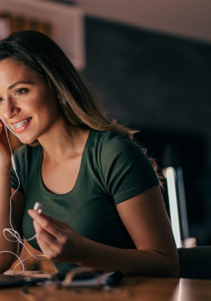 Young woman, listening to music online, and browsing,