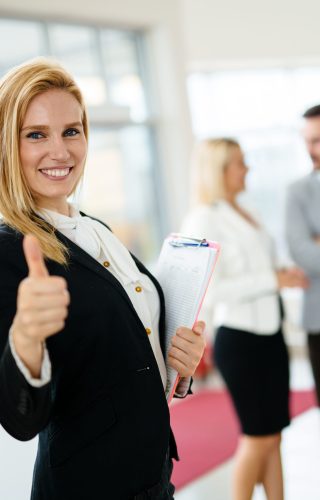 Portrait of happy young customer buying new car